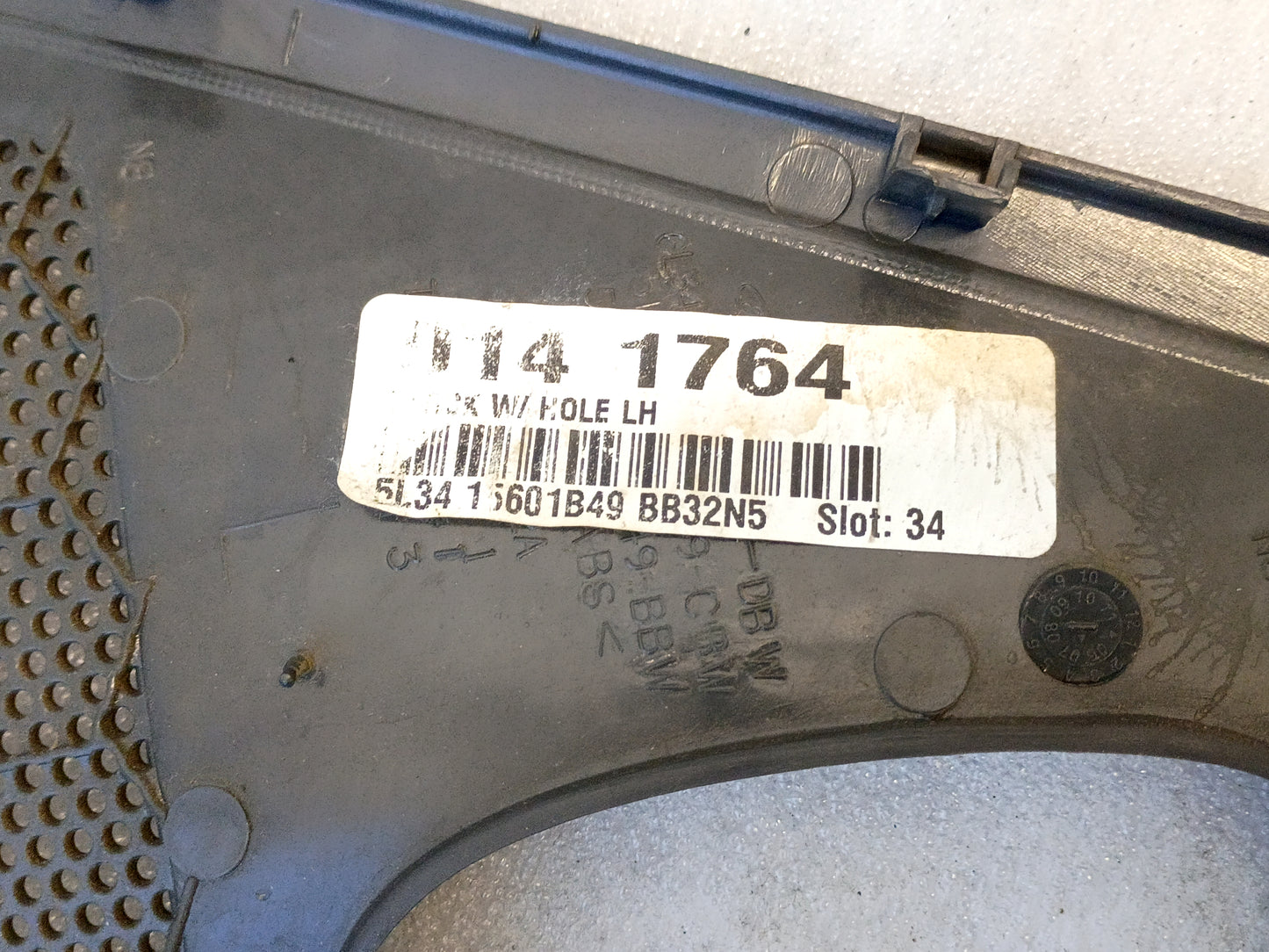 OEM Ford F-150 speaker grill cover, dark gray, with part label visible. Suitable for 2004-2008 models, set of two.