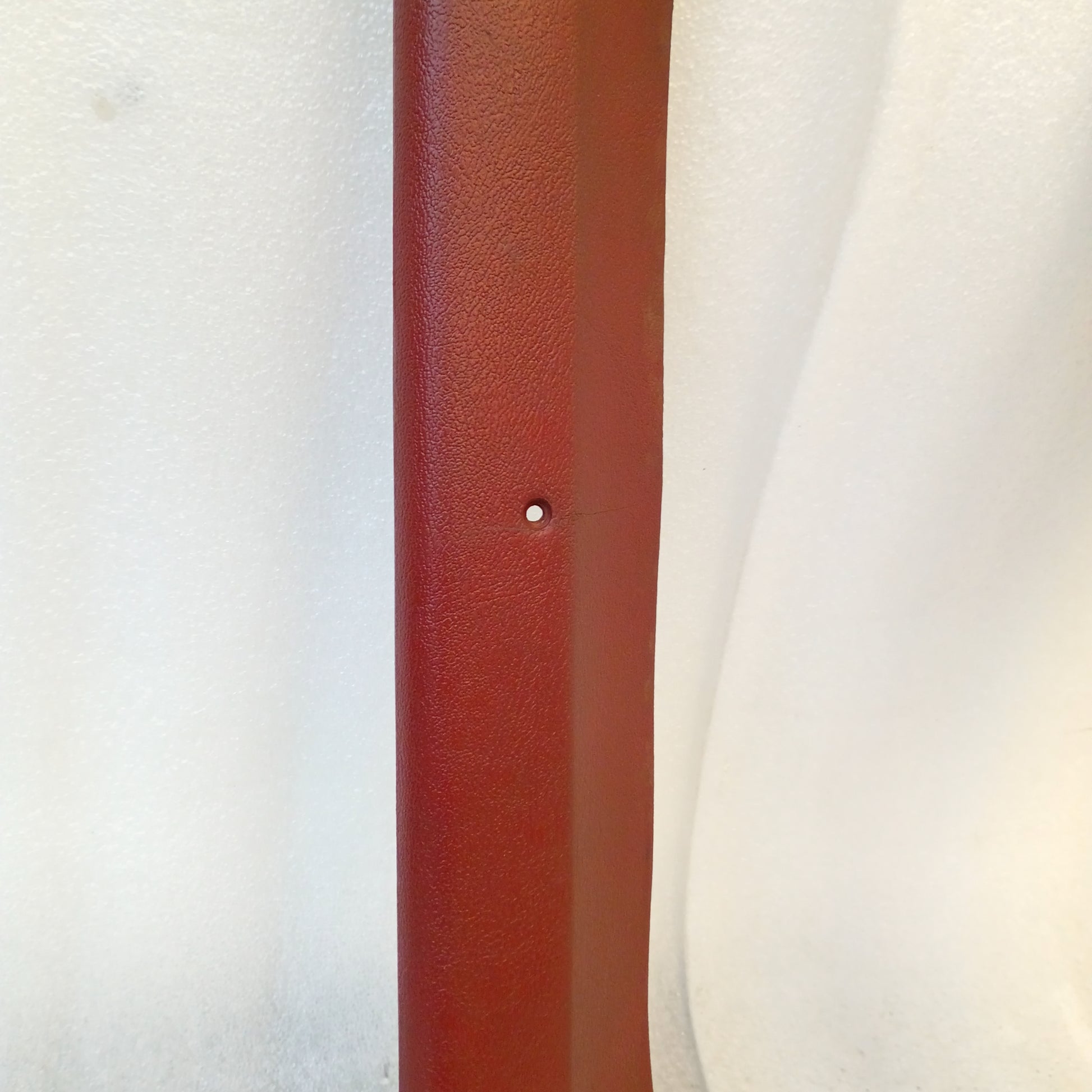 Red A Pillar Trim for 1980-1986 Ford Bronco, F-150, F-250, F-350; original Ford part, visible blemish.