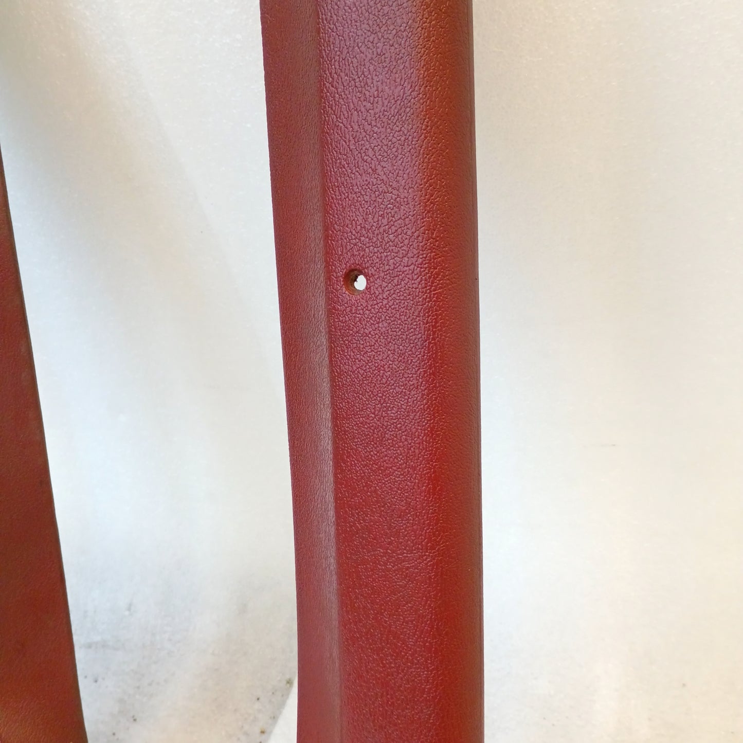 Red A-pillar trim set for 1980-1986 Ford F-Series and Bronco, showing textured finish and minor blemish.