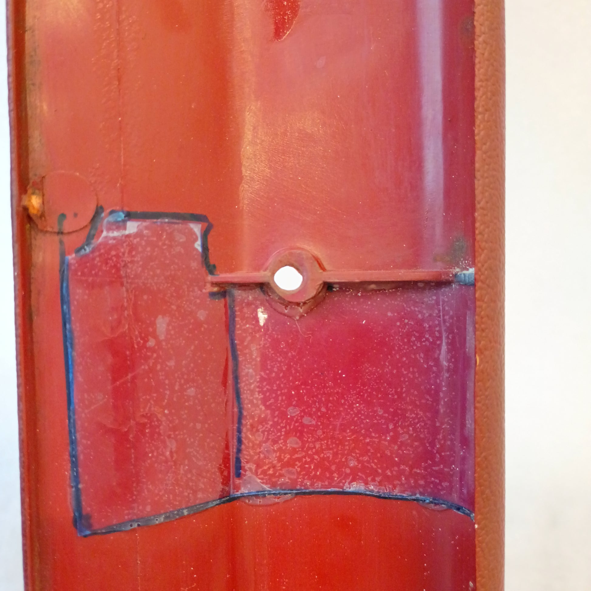 Red A-pillar trim piece for 1980-1986 Ford Bronco/F-Series, showing minor blemishes, fits models with headliner.