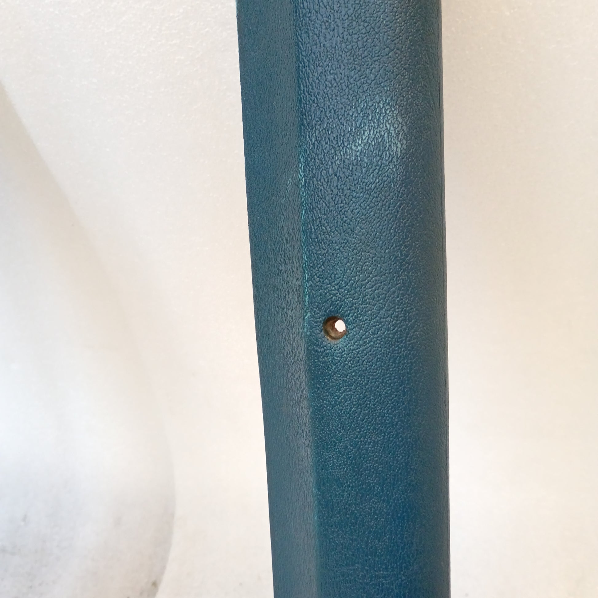 Harbor Blue A-pillar trim piece for 1980-1986 Ford trucks, textured surface, minor blemish visible.