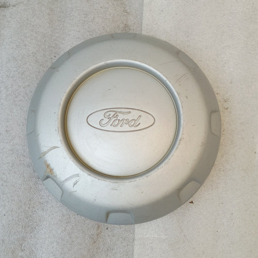 Silver OEM Ford center hub cap with logo, solid face, 8-lug fit, part number 5c34-1a096-cc, for '99-'04 F-250/F-350 Super Duty.