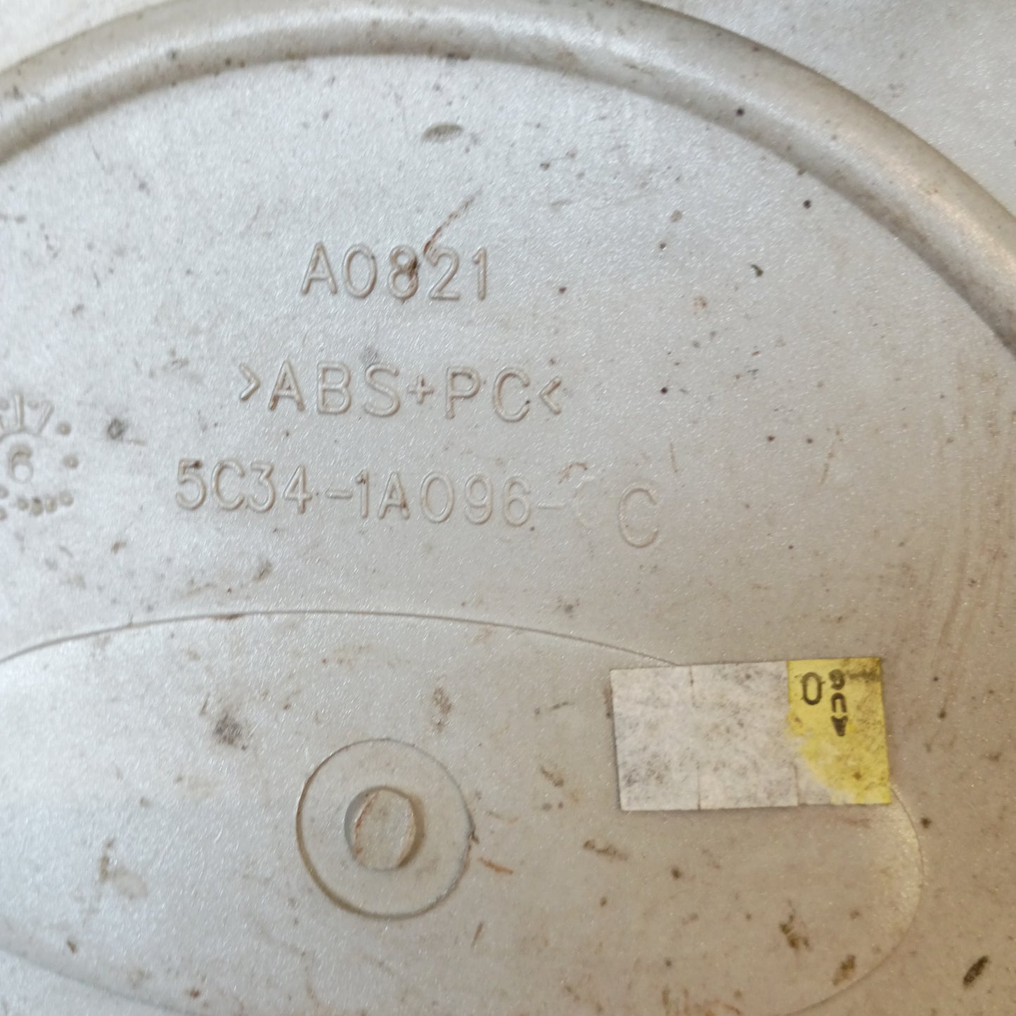 Silver Ford center hub cap with part number 5c34-1a096-cc, compatible with 1999-2004 F-250/F-350 Super Duty.