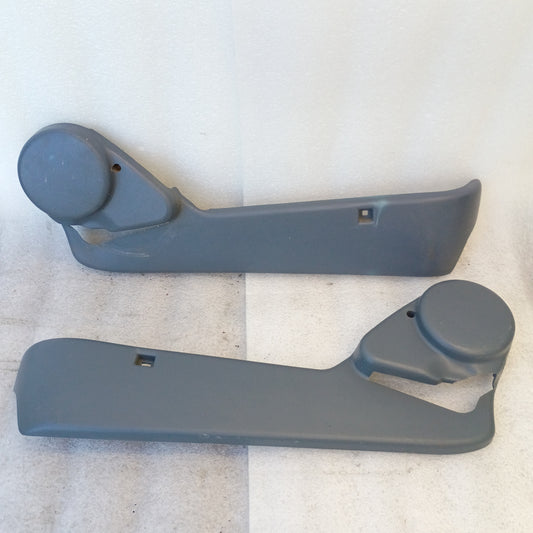Dark/Crystal Blue bucket seat side trim pair for Ford vehicles, 1992-1997, covering seat tracks and hinge mechanisms.