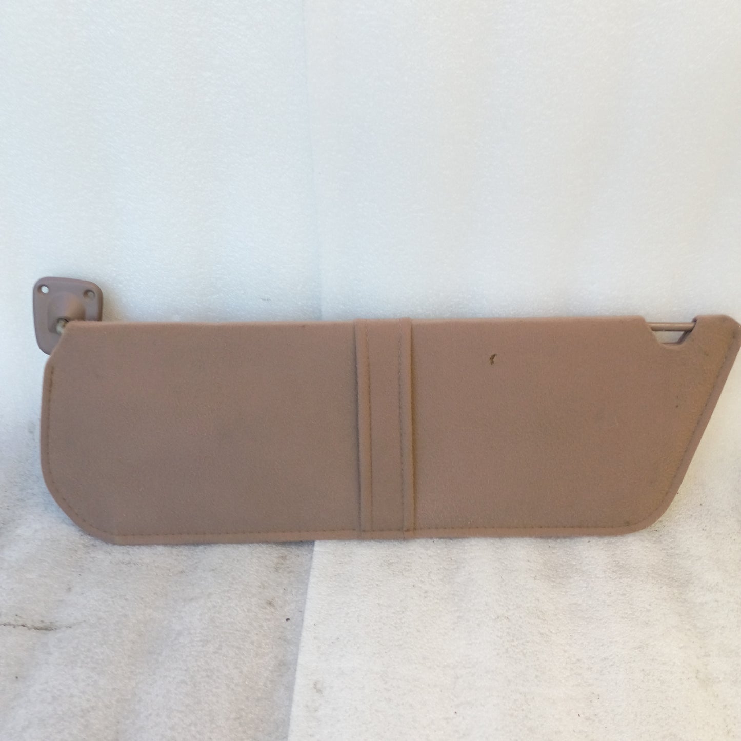 Tan cloth sun visor with mounting hinge, fits 1992-1996 Ford Bronco, F-150 and 1992-1997 F-250, F-350, OEM Ford part.