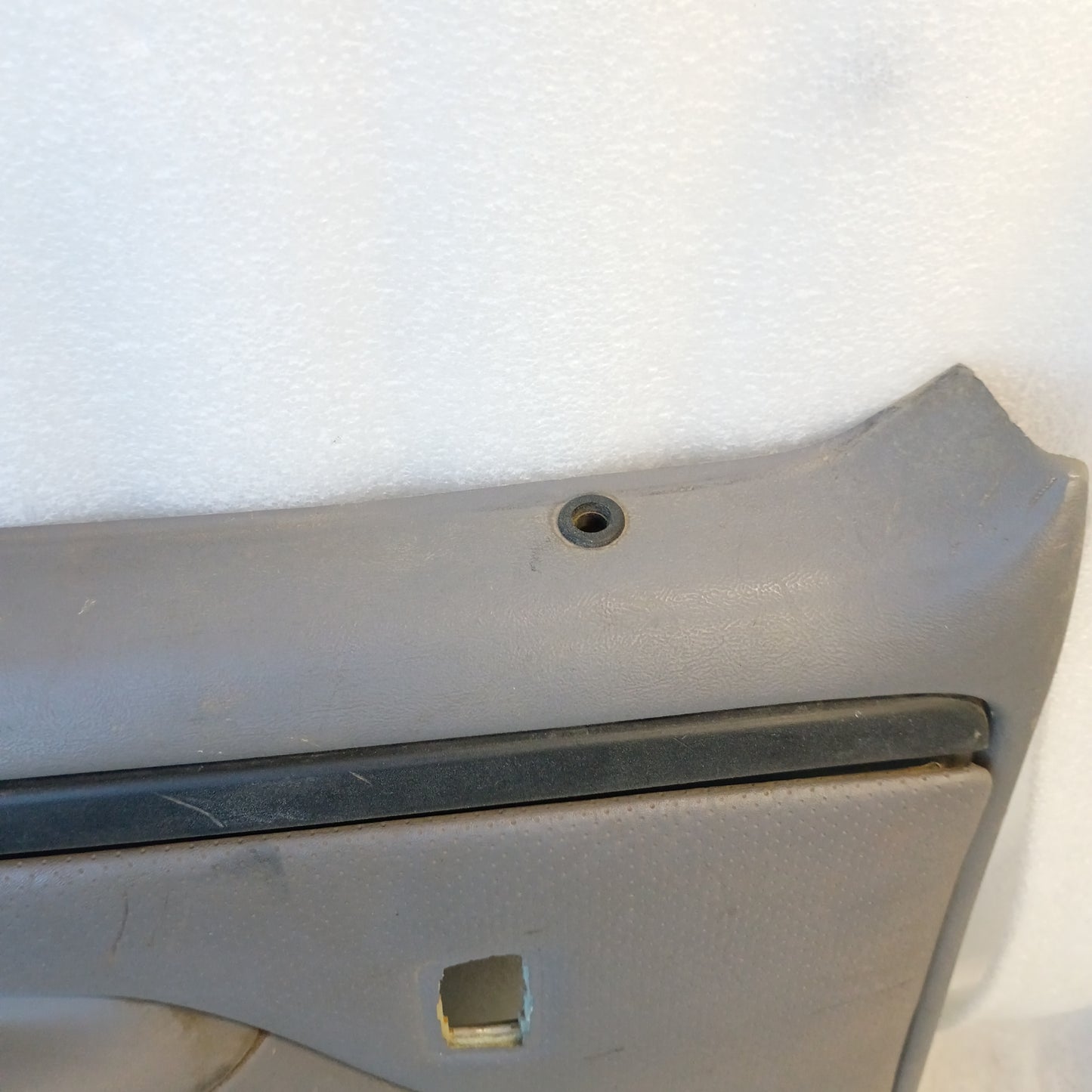Left rear crew cab door panel in light gray for Ford F250/F350 (1992-1997). Suitable for power windows, with intact plastic.