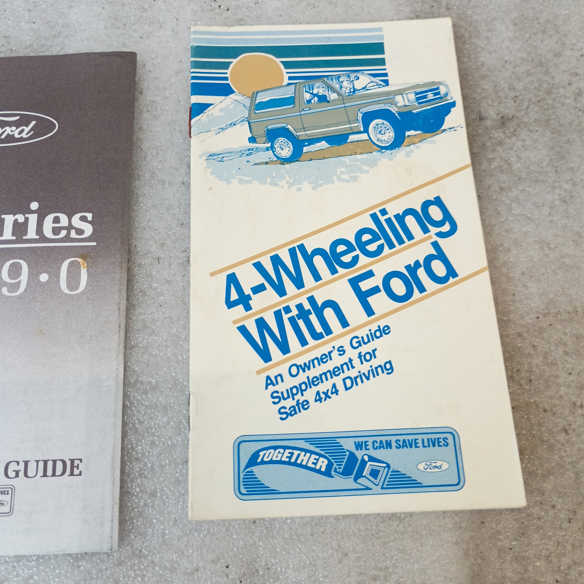 1990 Ford F-Series owner manuals with "4-Wheeling With Ford" guide, featuring illustration of Ford vehicle.