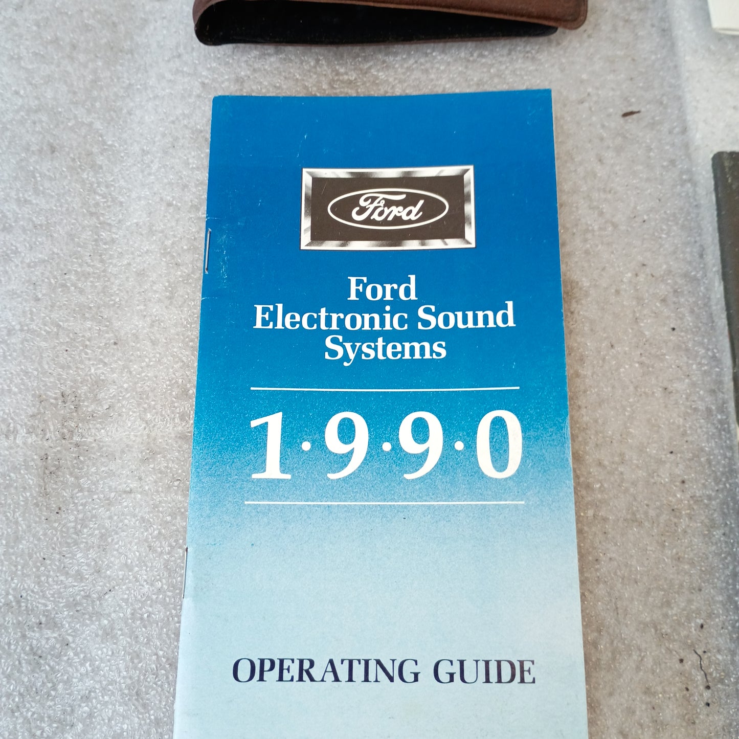 Ford Electronic Sound Systems 1990 Operating Guide with blue cover, part of the F-Series owner manual set.