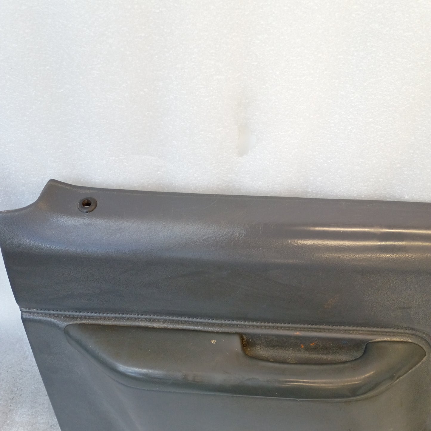 Dark gray Ford truck door panel, compatible with 1987-1991 F150, F250, F350, Bronco; manual windows, original OEM part.