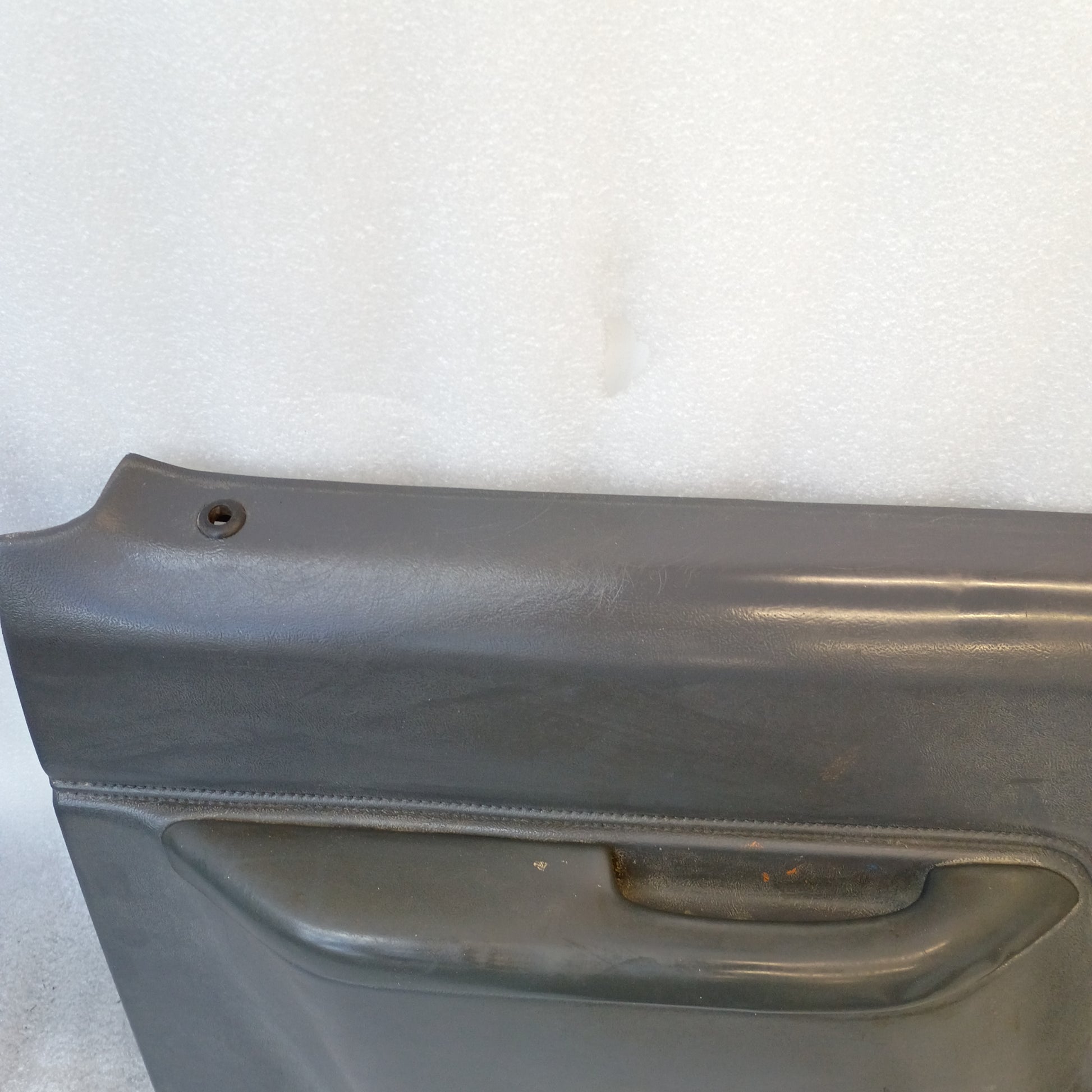 Dark gray Ford truck door panel, compatible with 1987-1991 F150, F250, F350, Bronco; manual windows, original OEM part.