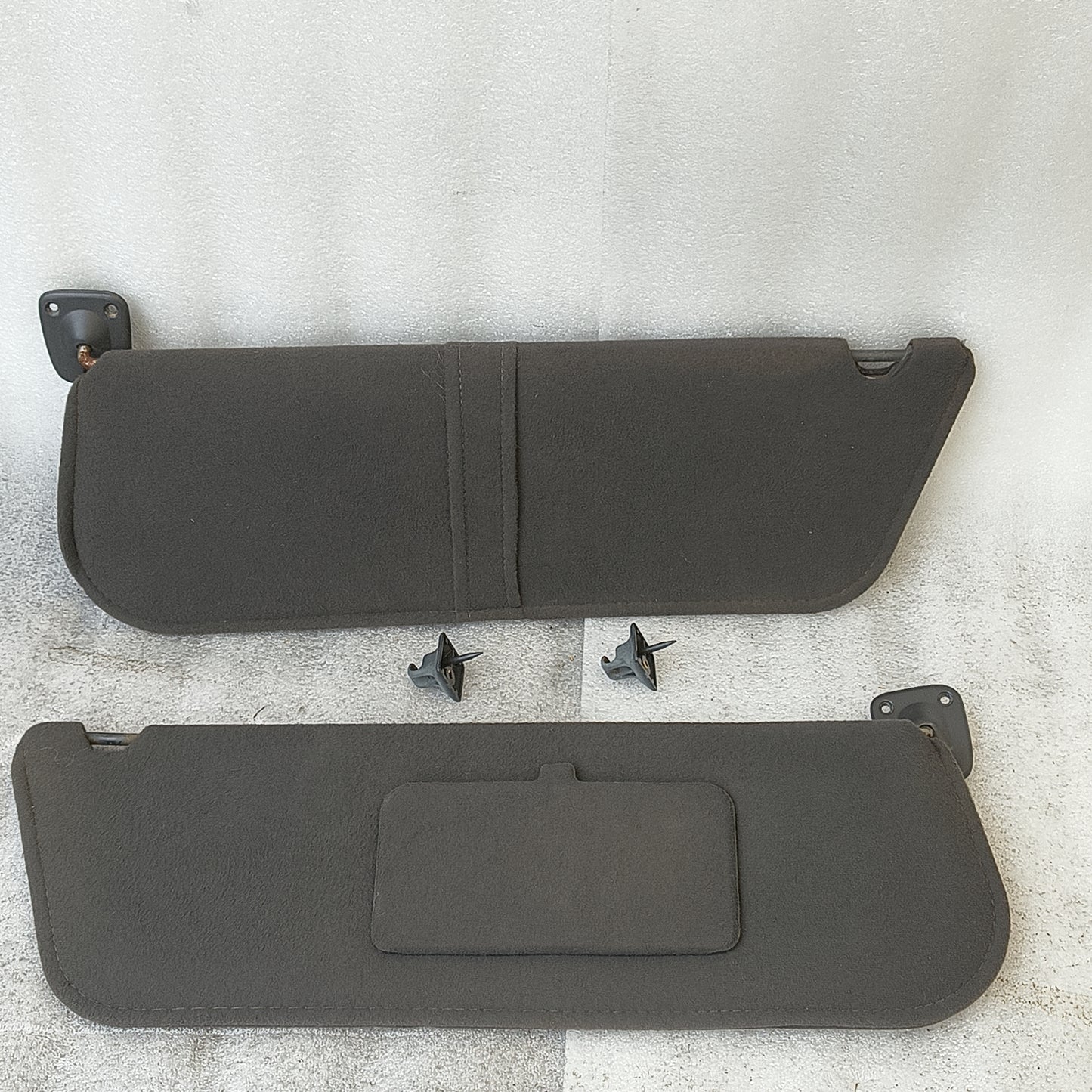 Dark granite gray cloth sun visors pair for Ford Bronco and F-Series, includes hinges, driver loop, and passenger mirror.