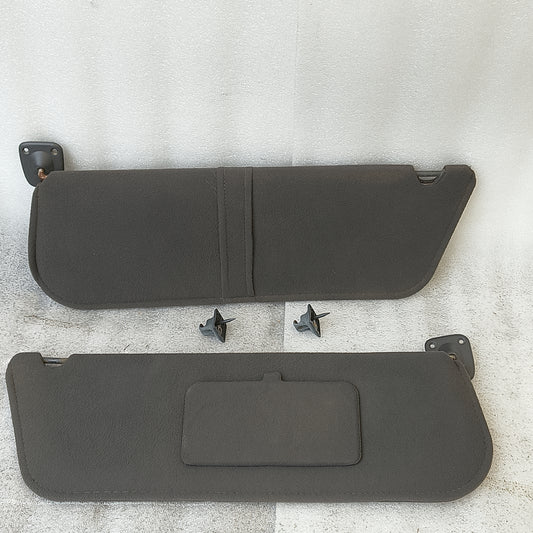 Dark granite gray cloth sun visors pair for Ford Bronco and F-Series, includes hinges, driver loop, and passenger mirror.