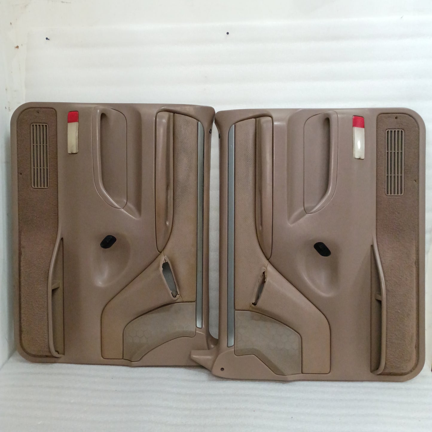 Tan Ford F150-F350 door panels with silver trim, red corner reflectors, and speaker grills, for models 1992-1997.