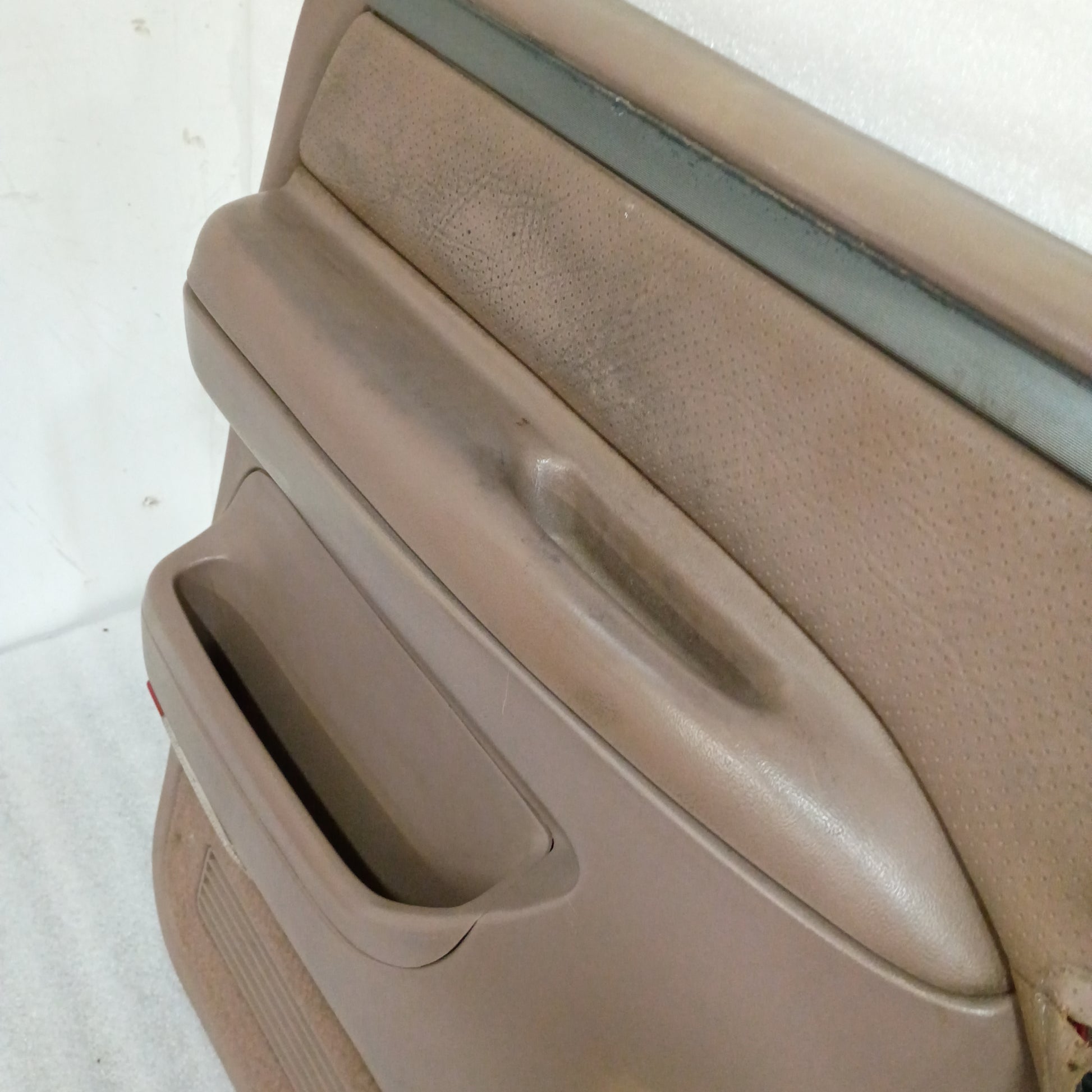 Tan Ford truck door panel with vinyl armrest, black trim strip, and map pocket. Compatible with 1992-1997 F-Series/Bronco.
