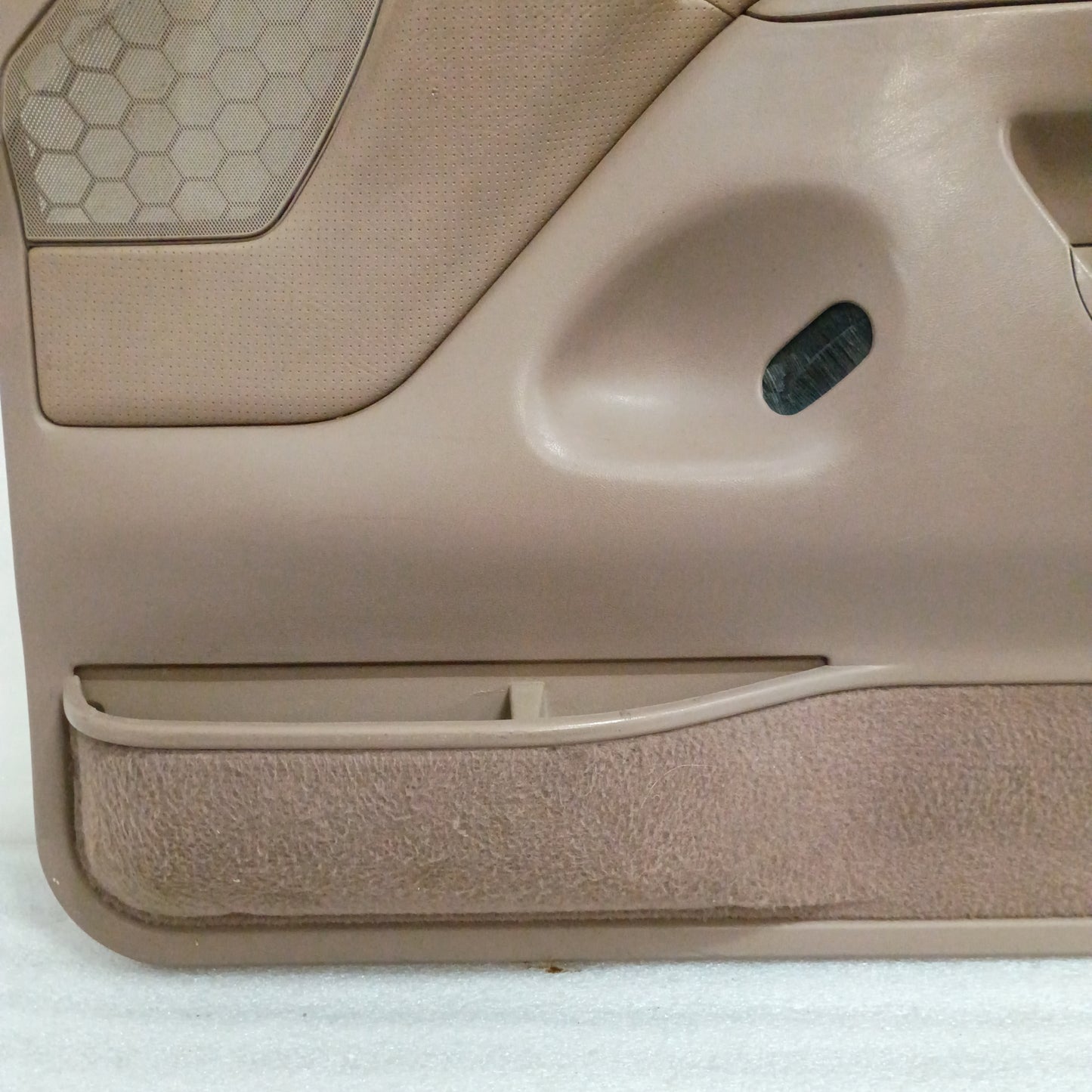 Tan Ford door panel with black trim, vinyl armrest, clear lens, and carpet. Fits 1992-1997 F150, F250, F350, Bronco.