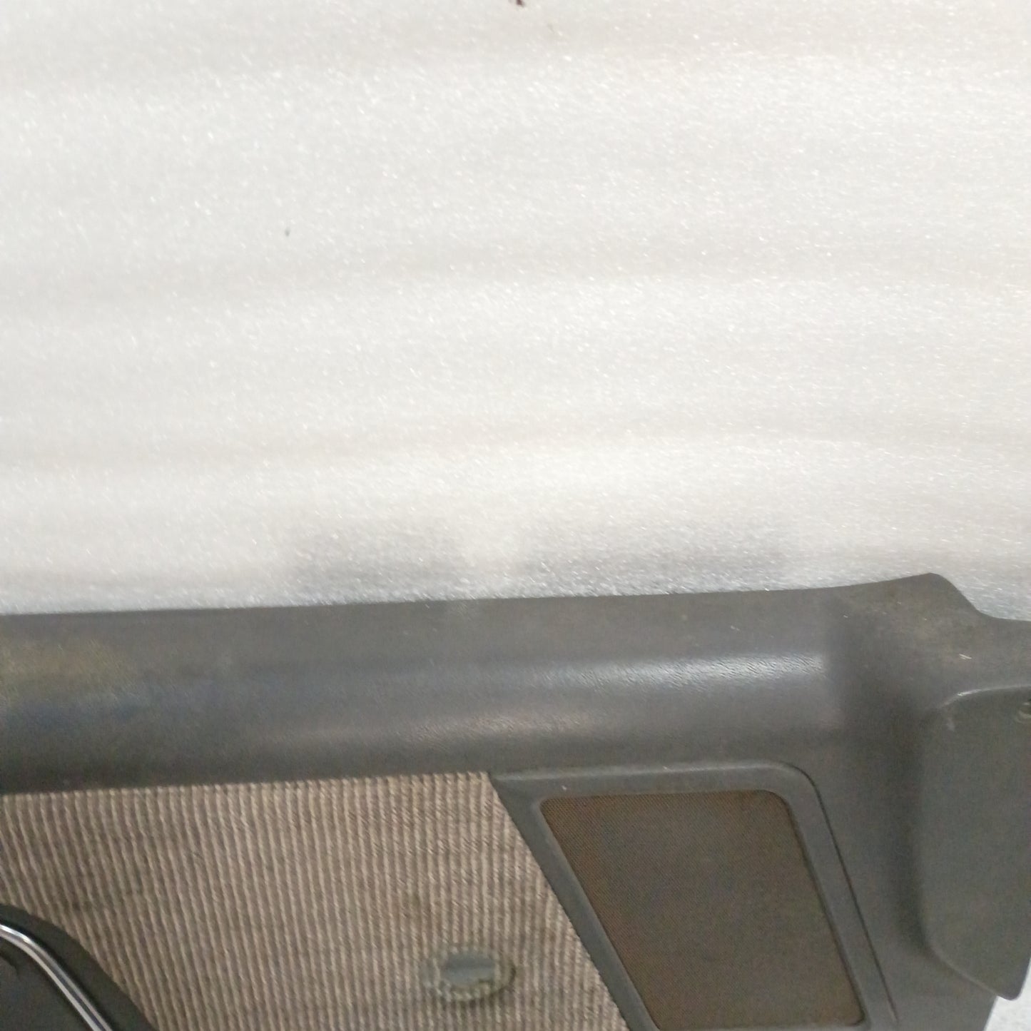 Dark gray deluxe door panel with carpeted insert for 1987-1991 Ford F-Series/Bronco, manual windows, in good condition.