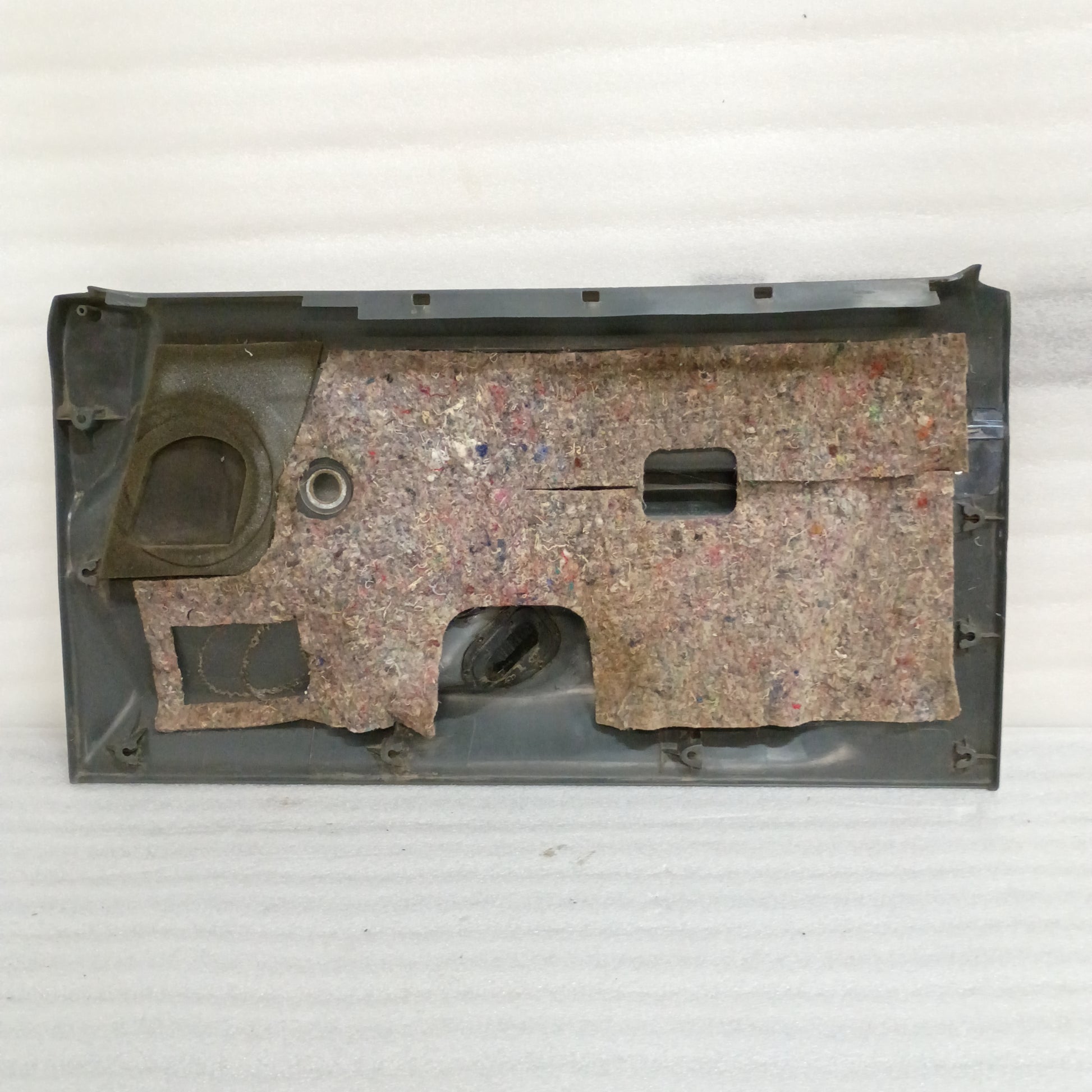 Deluxe dark gray door panel for 1987-1991 Ford F150-F350, Bronco; manual windows, original OEM, good condition.