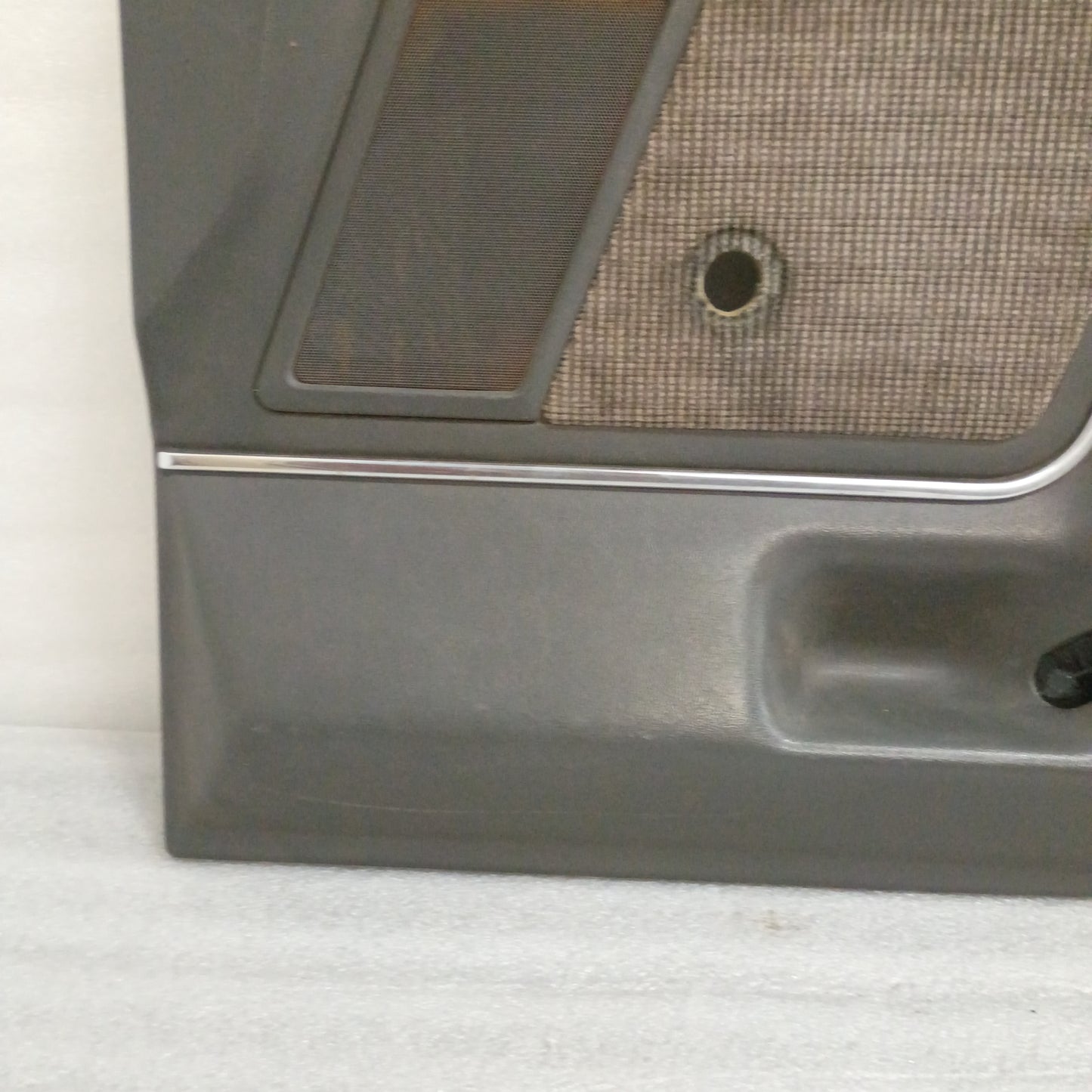 Deluxe dark gray door panel with speaker grille and carpeted map pocket insert for 1987-1991 Ford F-series trucks.