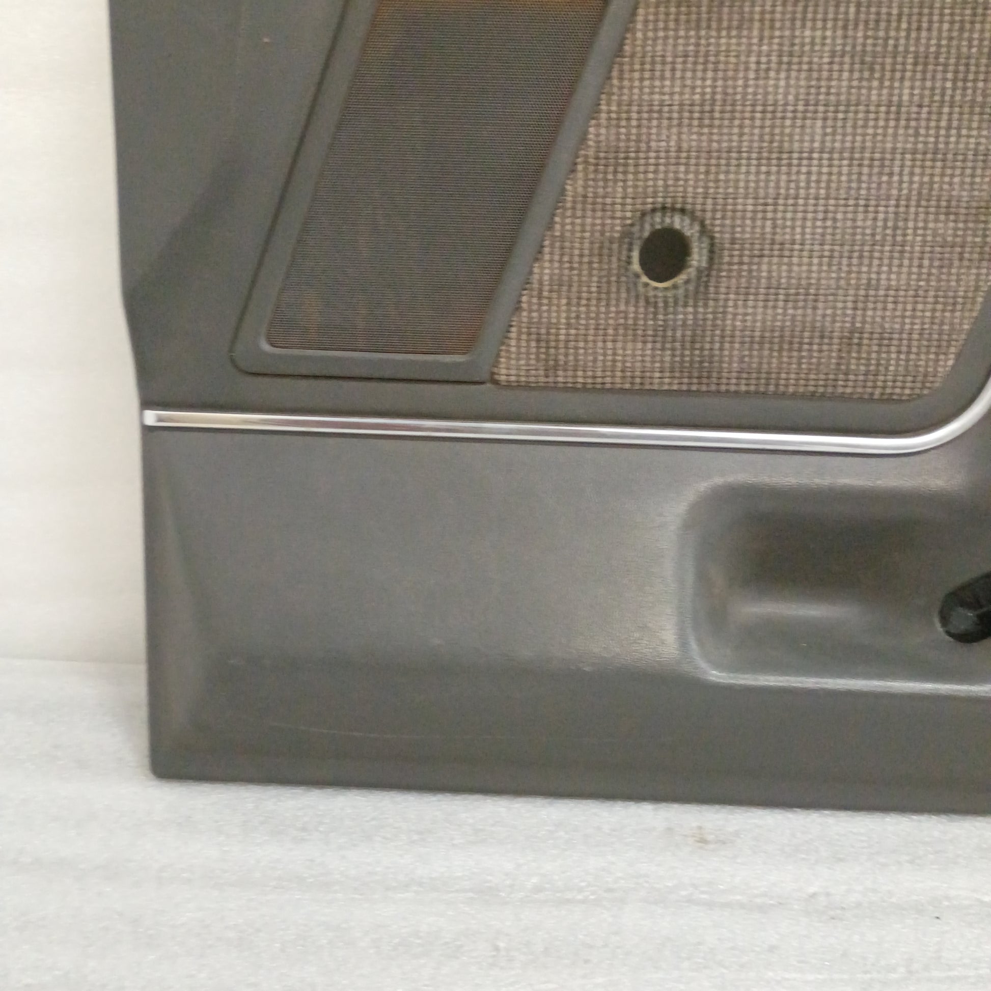 Deluxe dark gray door panel with speaker grille and carpeted map pocket insert for 1987-1991 Ford F-series trucks.