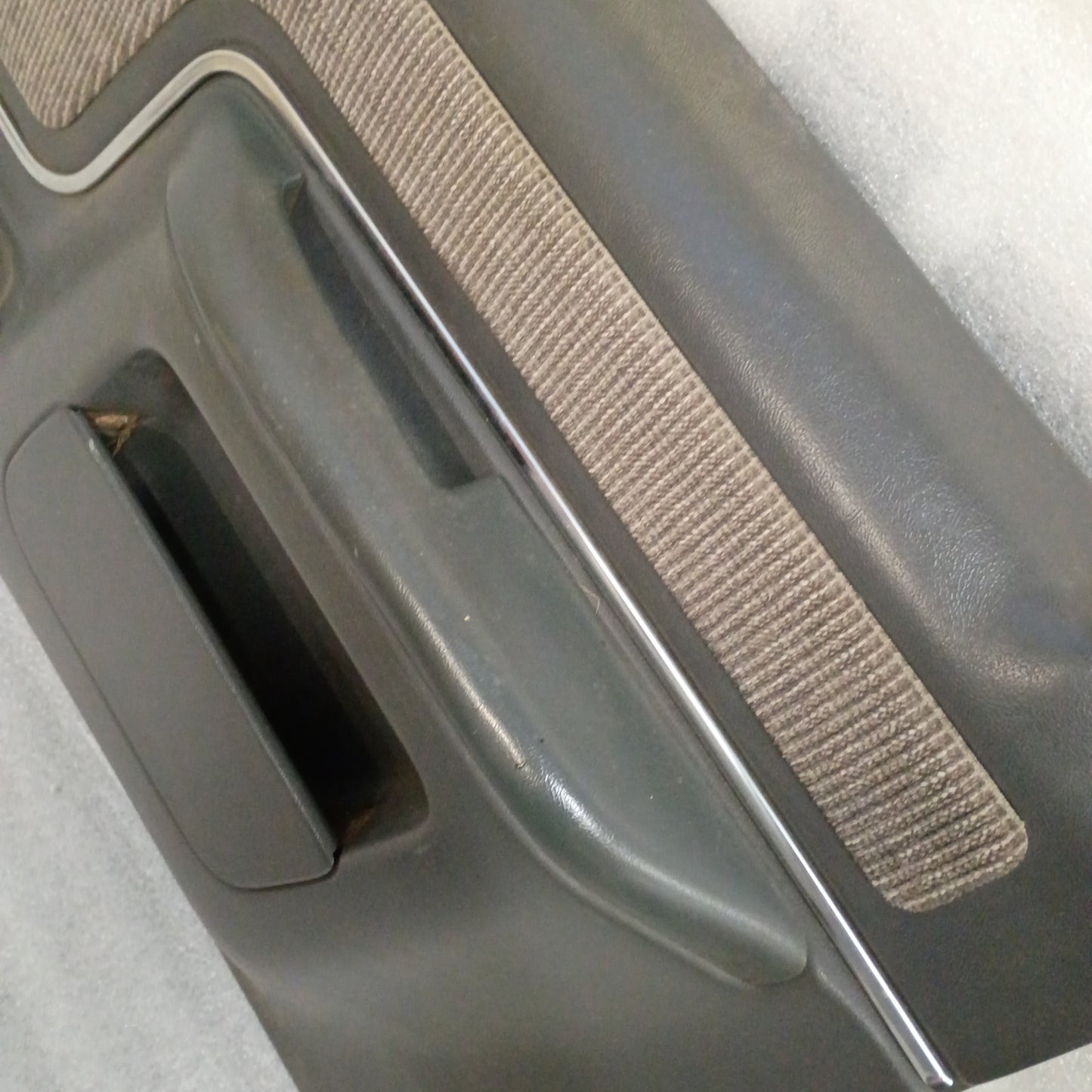 Deluxe dark gray door panel set with manual window controls for 1987-1991 Ford trucks, featuring carpeted inserts.