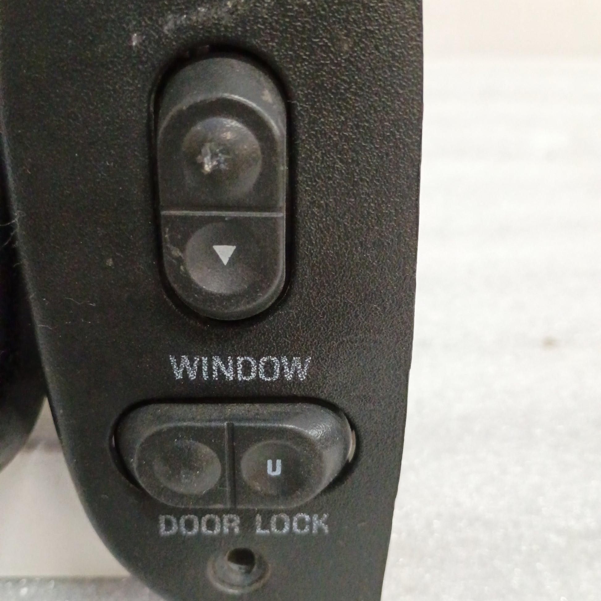 Black power window and door lock switch for 1992-1996 Ford F-150, F-350, Bronco.