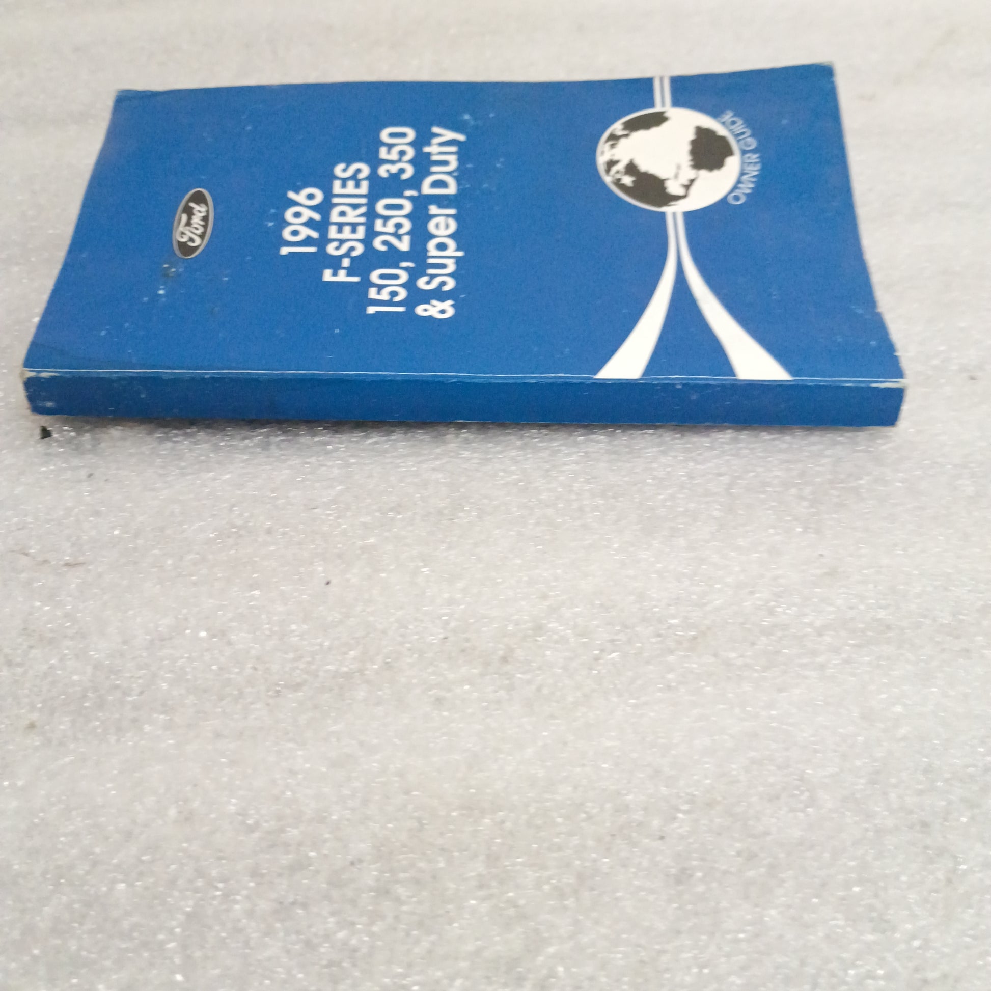Blue 1996 Ford F-Series Owner Guide for F-150, F-250, F-350, Super Duty, OEM manual, showing signs of wear.