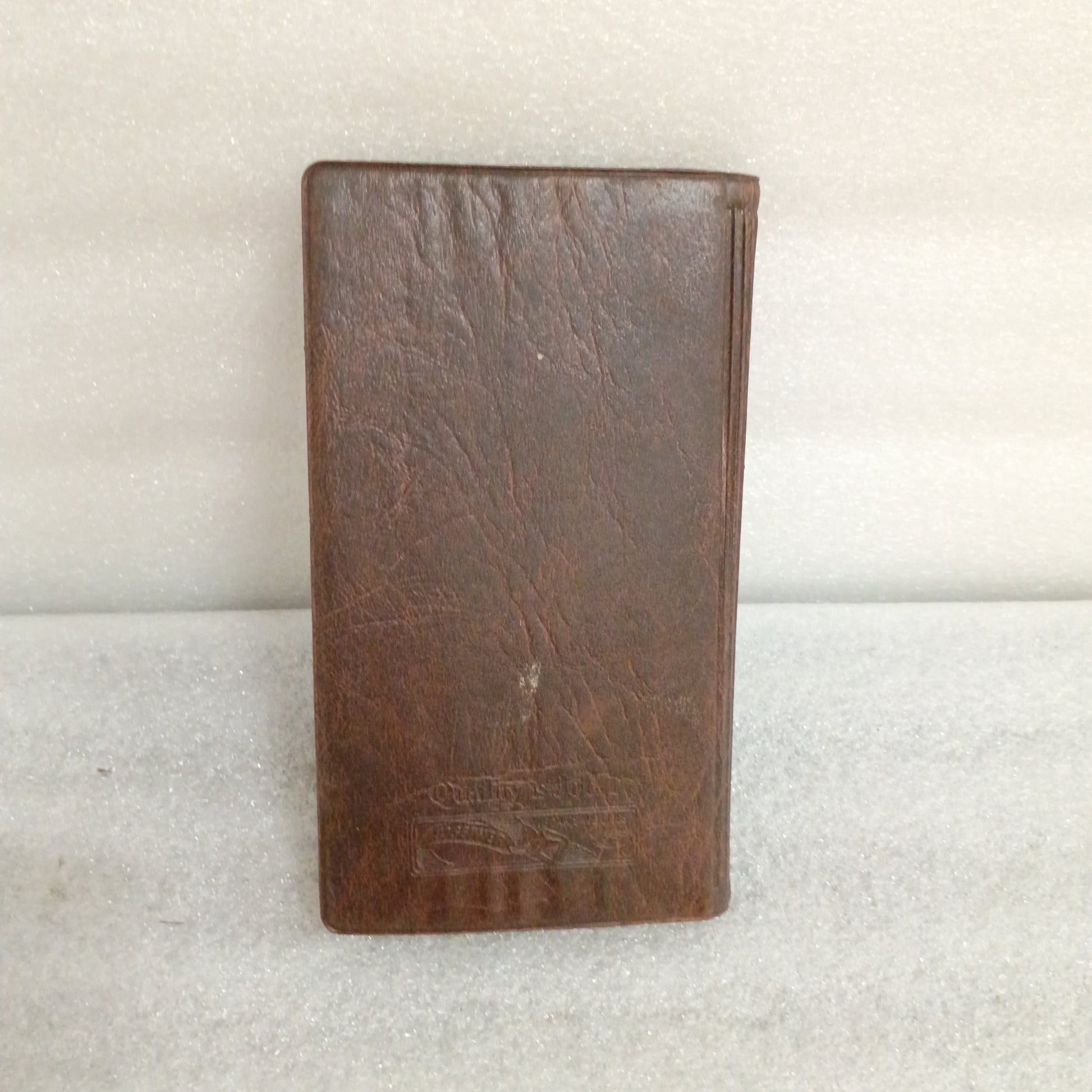 Brown leather case for 1996 F-Series Owner Guide, Ford F-150, F-250, F-350, showing slight exterior wear.
