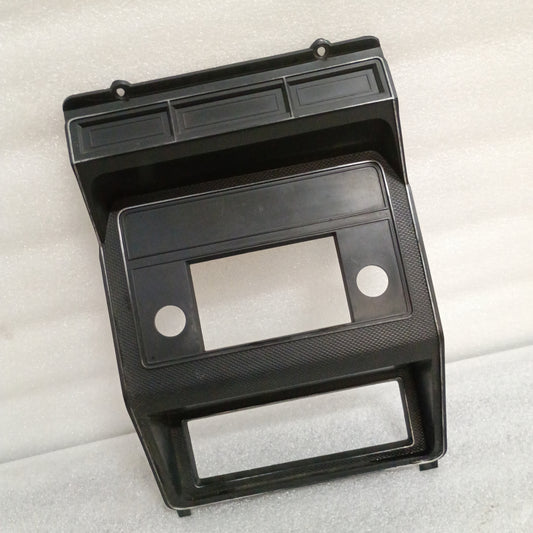 Black radio and heater bezel for Ford F150, F250, F350, Bronco (1980-1986) with silver pinstriping, textured finish.