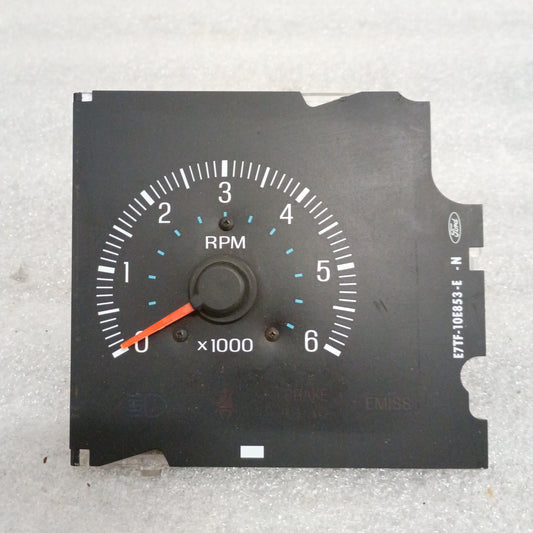 Refurbished Ford F150-F350 Bronco OEM tachometer with RPM gauge, orange needle, and emission indicator, part E8TF-10E853-R N.