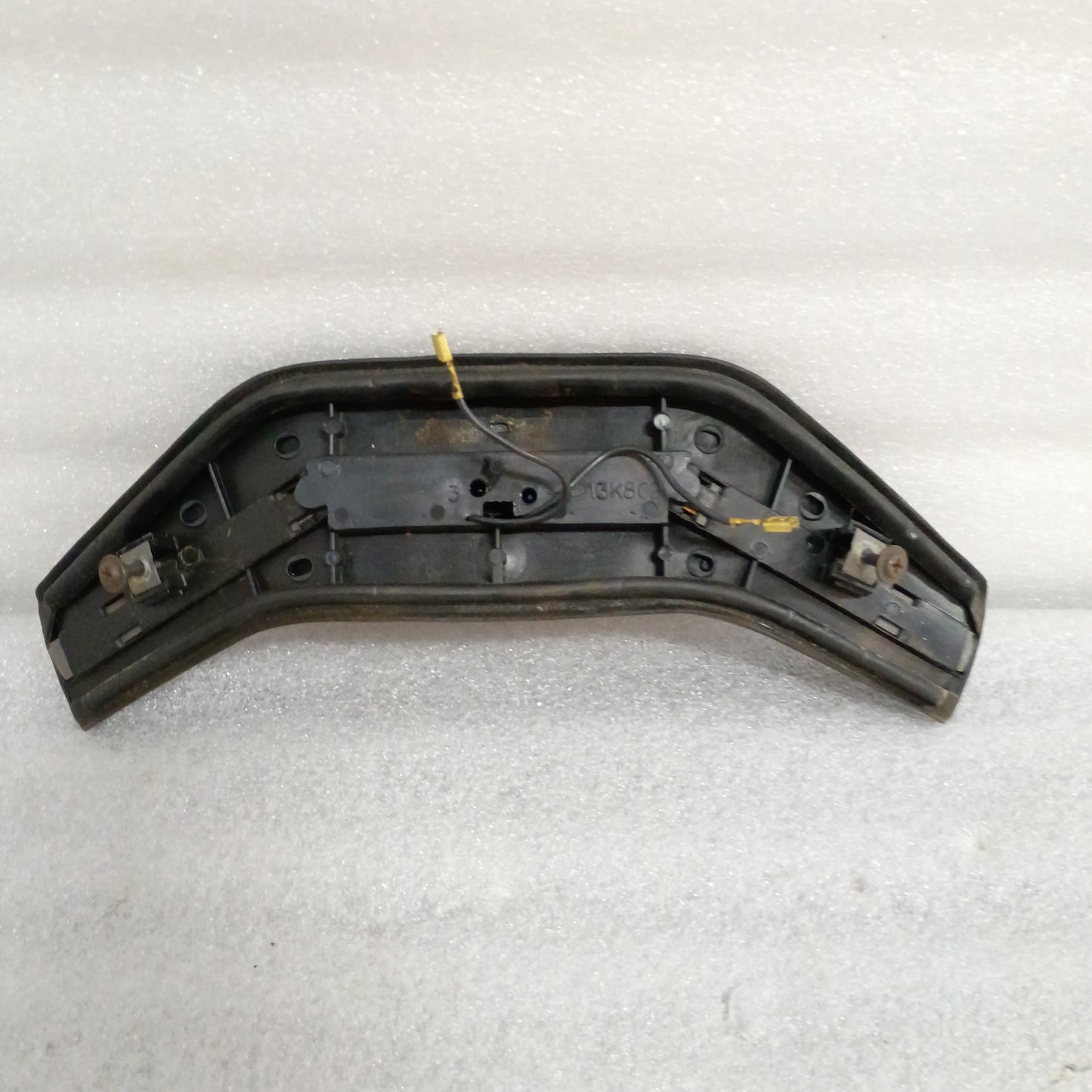 Black steering wheel horn button pad, compatible with Ford F150, F250, F350, Bronco. Features part number 13K803.