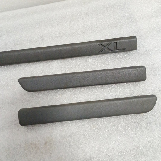 Set of three charcoal gray dash trim strips for Ford F150/F250/F350/Bronco, including one long strip with "XL" engraving.