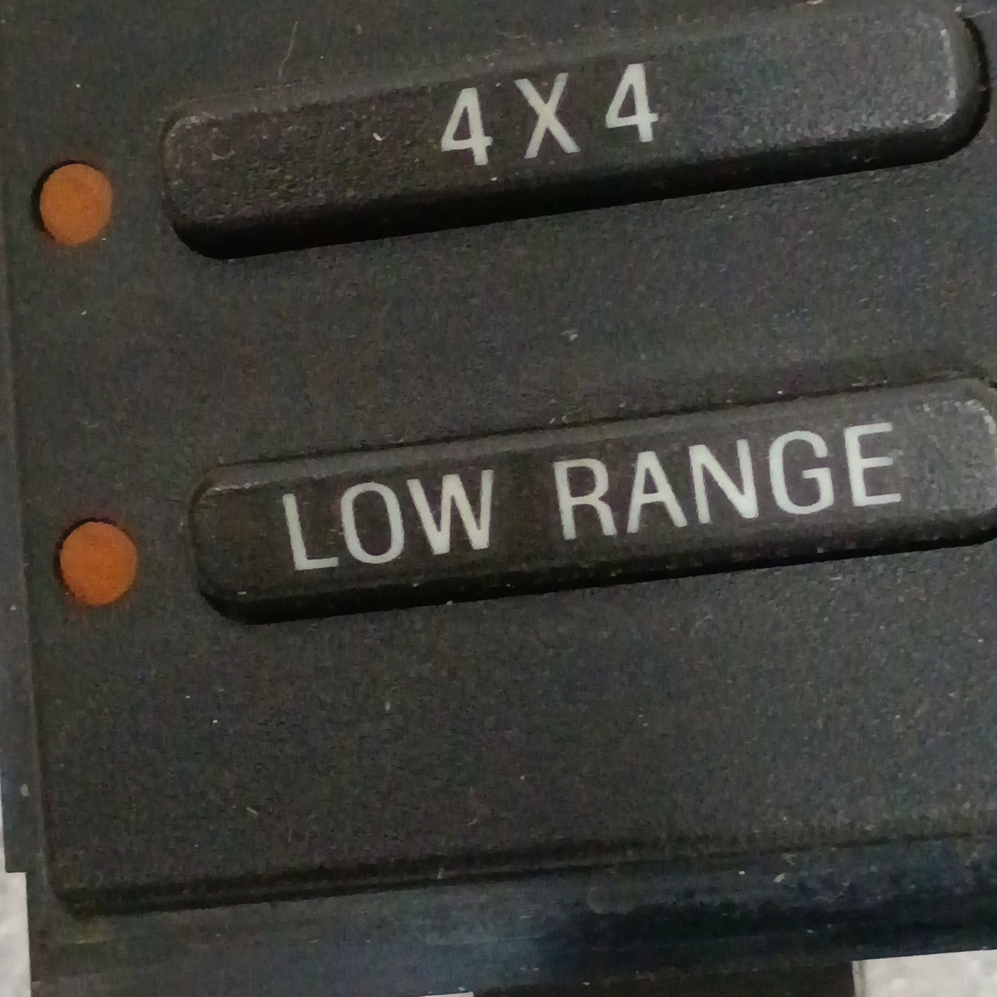 Electronic transfer case switch with "4X4" and "LOW RANGE" options, compatible with '94-'97 Ford trucks, in very good condition.