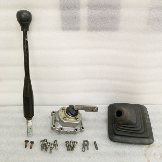 ZF5 manual transmission shifter kit for Ford F250/F350, includes shifter arm, knob, rubber boot, bracket, bolts, detent, spring.