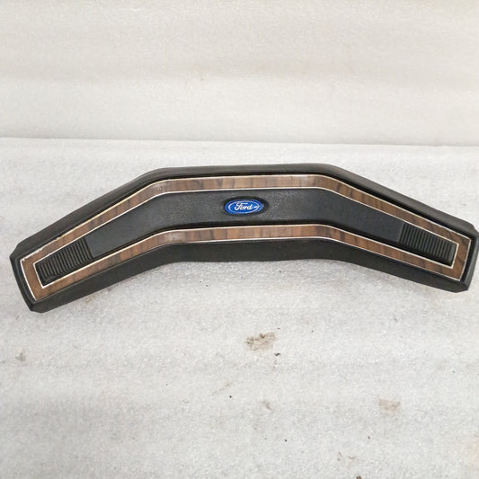 Ford steering wheel horn button with rosewood detailing, OEM, featuring push button, compatible with 1980-1986 Ford trucks.
