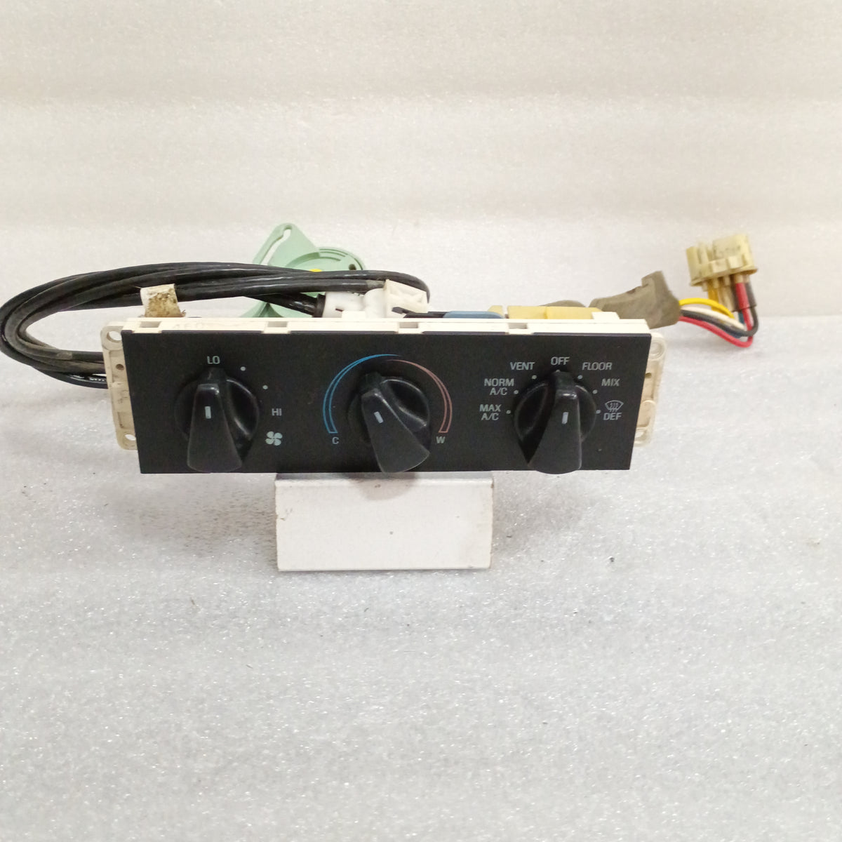 Ford dual cable HVAC control panel assembly with knobs for temperature, fan speed, and function. Compatible with 1992-1997 F-Series and Bronco.