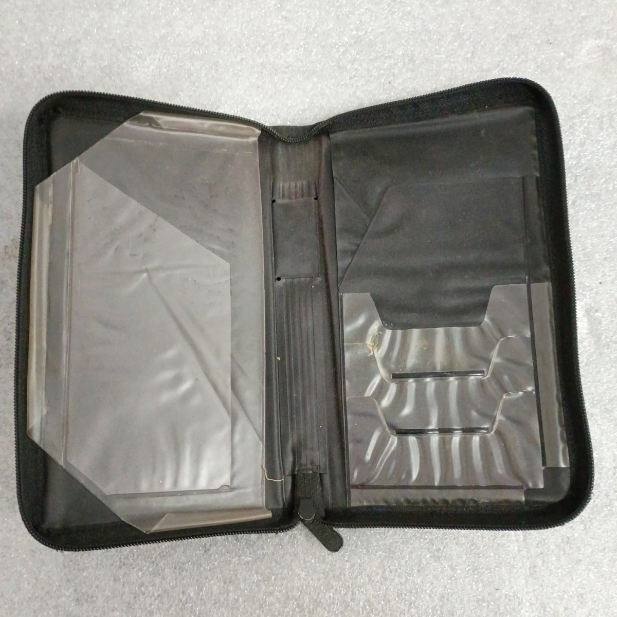 Open black vinyl case for 1997 Ford F-250 HD F-350 owner guide manual set with inserts and zipper.