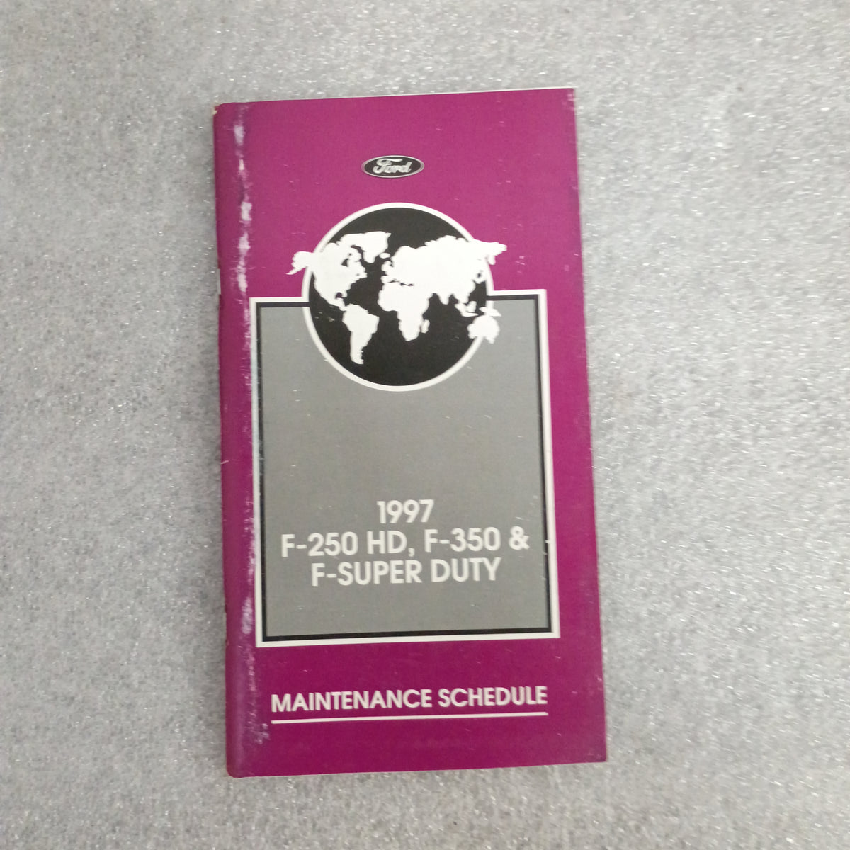 1997 Ford F-250 HD, F-350 & Super Duty maintenance schedule booklet with purple cover and globe design.