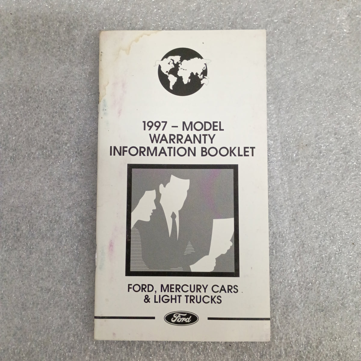 1997 Model Warranty Information Booklet for Ford Mercury Cars & Light Trucks, featuring a graphic of two figures.
