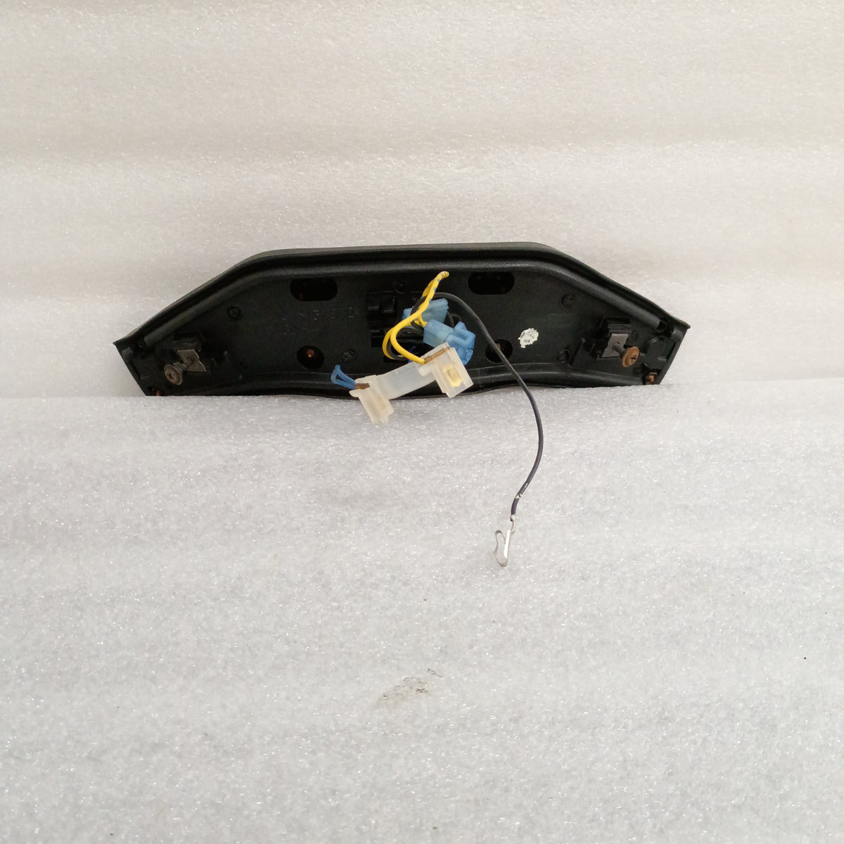 Ford steering wheel horn pad with wiring, featuring cruise control buttons. OEM part compatible with 1980-1986 Ford trucks.