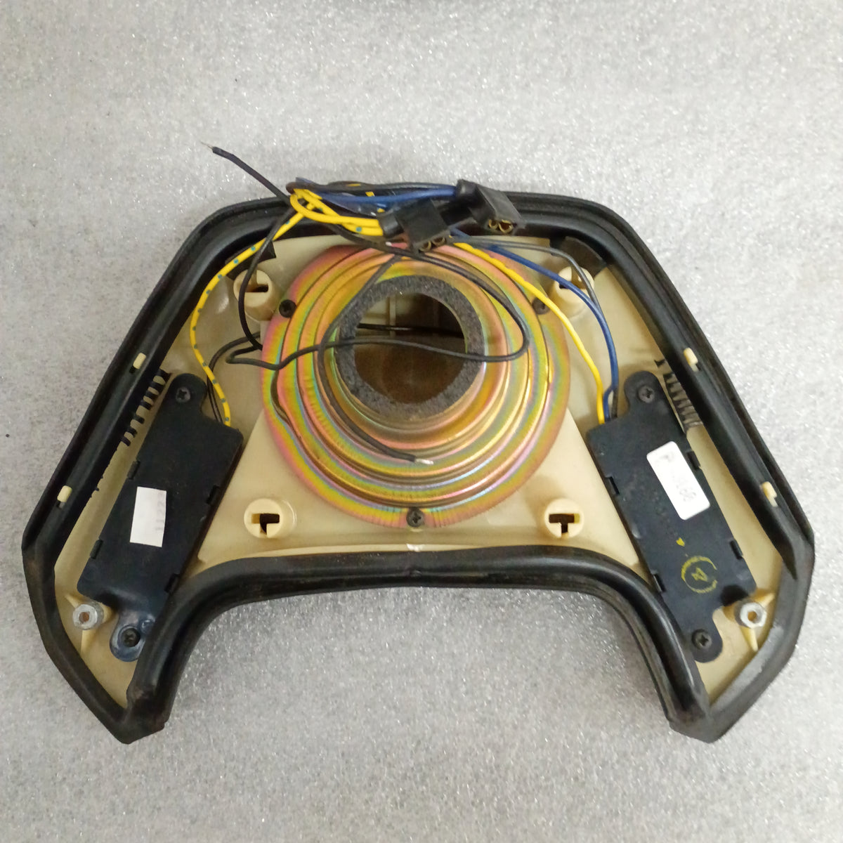 OEM Ford steering wheel back with horn pad and cruise control wiring, compatible with 1987-1991 F-Series and Bronco.