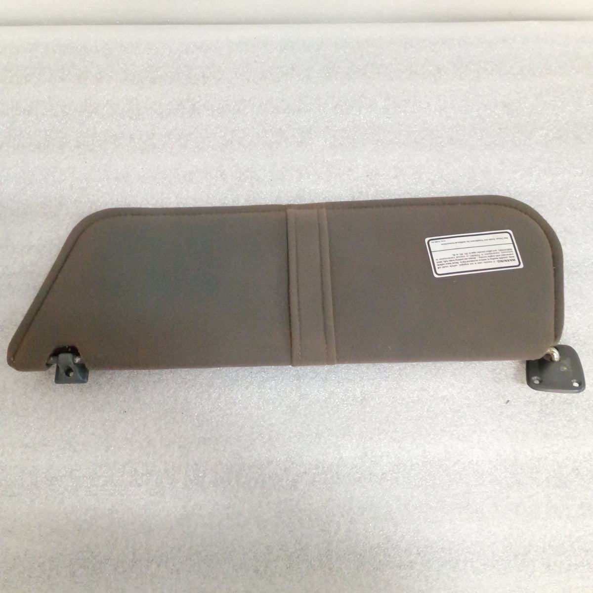 Dark gray cloth sun visor with mounting hinges, compatible with 1987-1991 Ford Bronco, F-150, F-250, and F-350.
