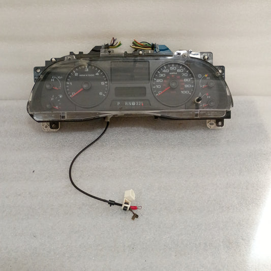 Ford gauge cluster for 05-07 F250/F350 Super Duty Gas. Includes speedometer, tachometer, boost, engine, transmission, and fuel gauges.