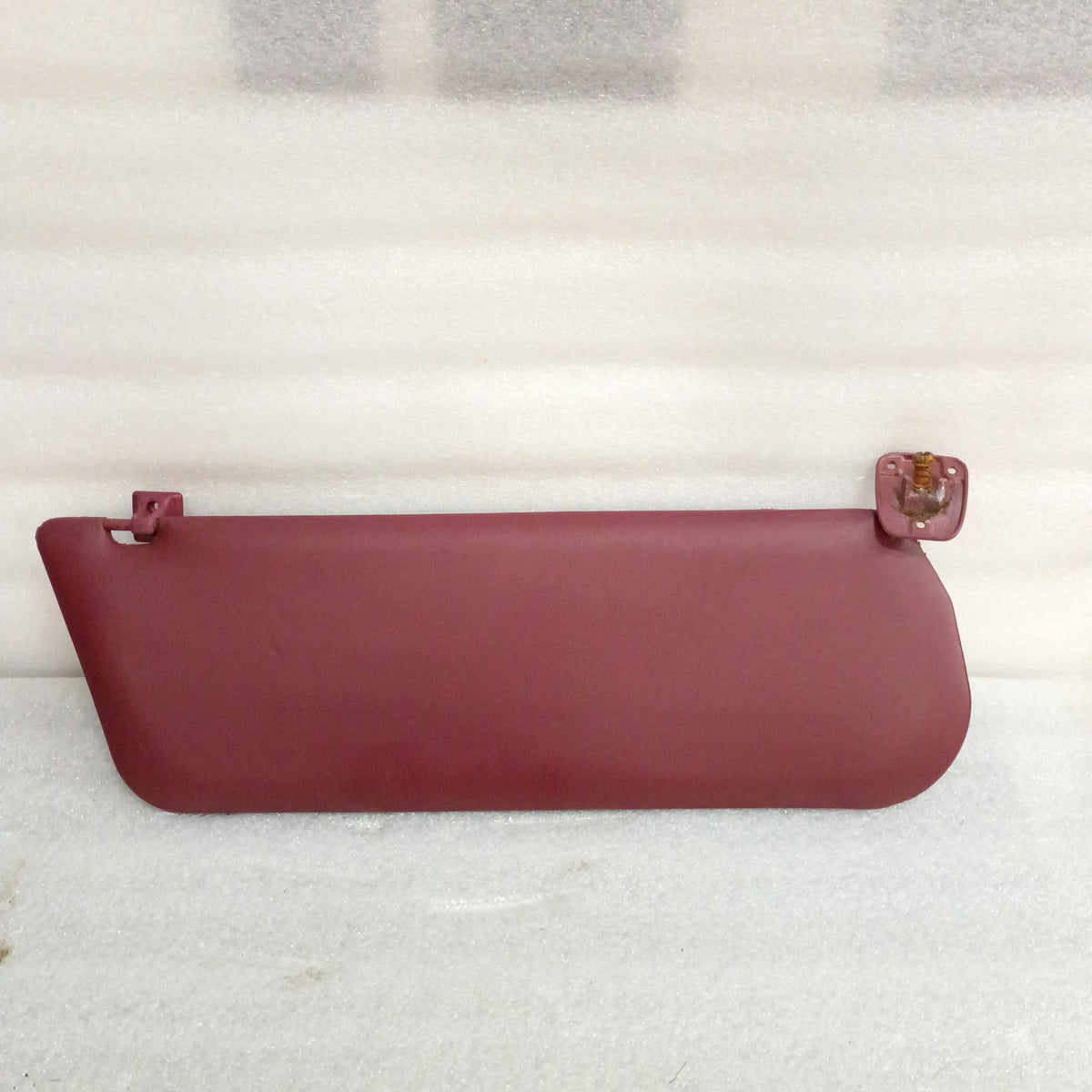 Dark red vinyl sun visor with hinges for 1992-1997 Ford trucks and Bronco, OEM Ford part E0TB-1004122-AWD.