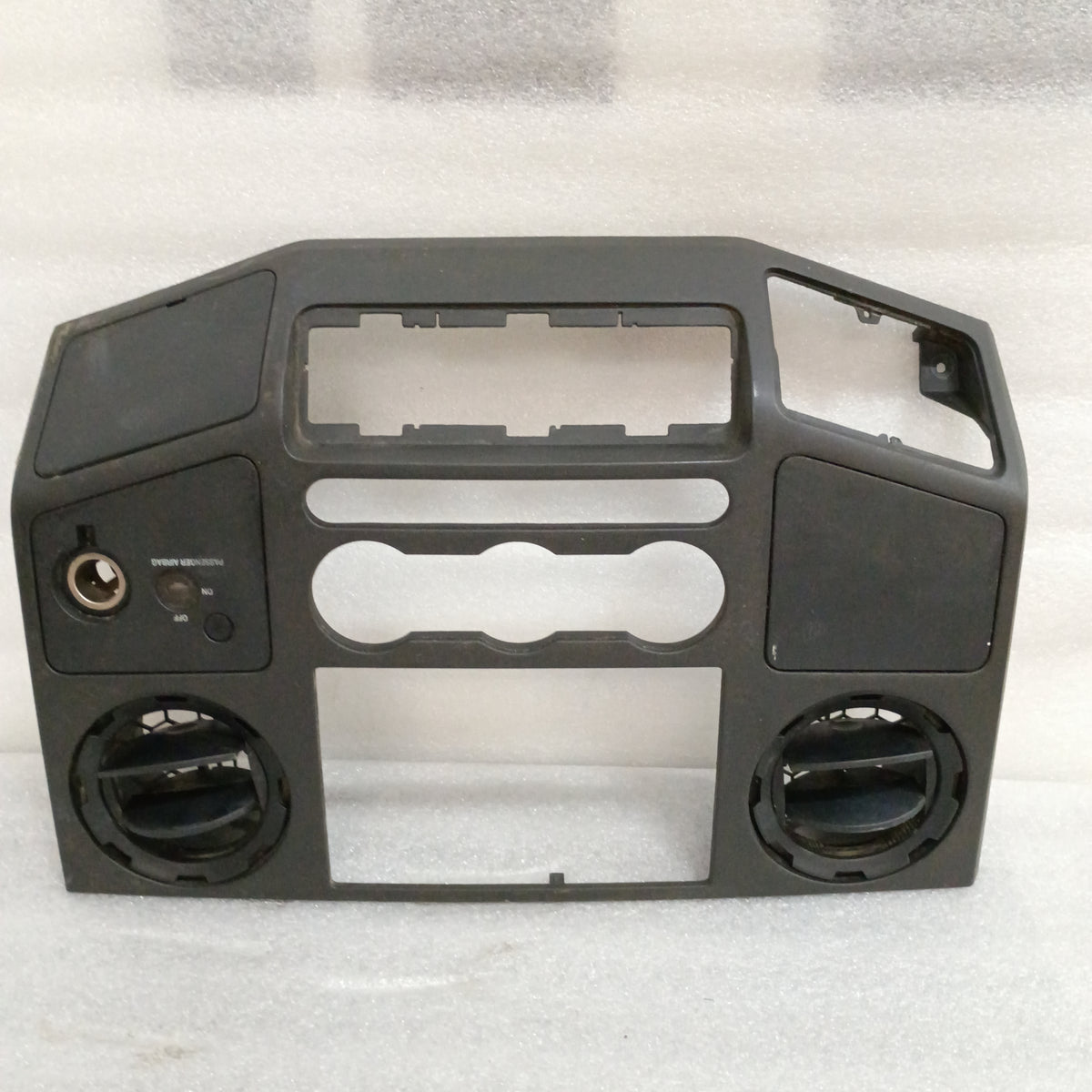 Black center dash bezel for 08-10 Ford F250/F350, walnut wood grain, with openings for heater, radio, switches, and connectors.