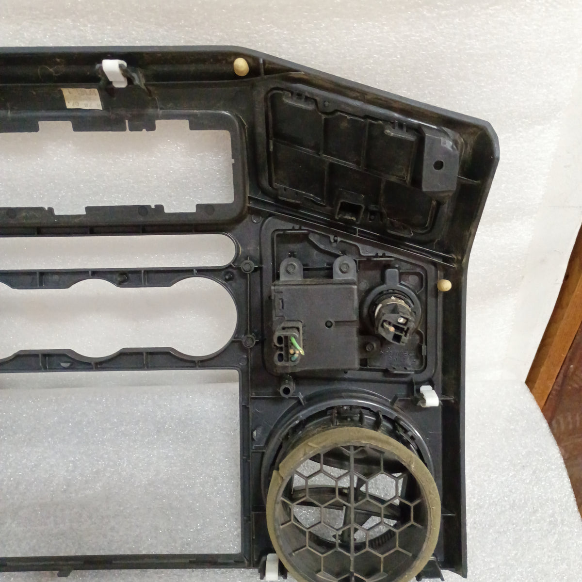 Black center dash radio and heater bezel with openings, walnut wood grain, fits 2008-2010 Ford F250/F350 Super Duty.