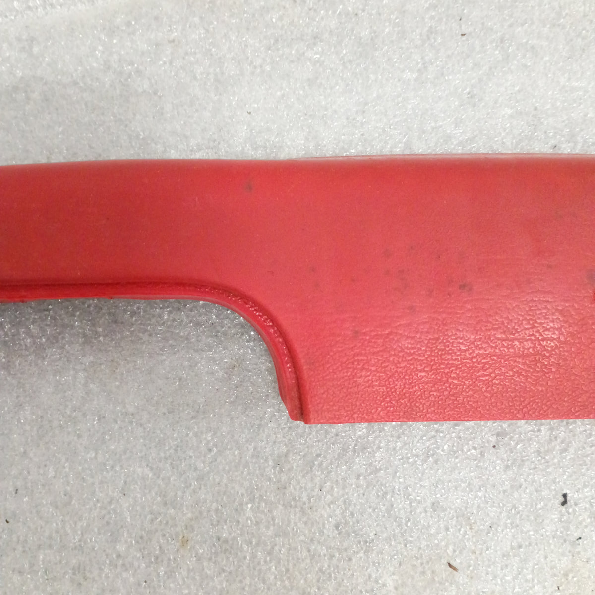 Red arm rest for 1973-1979 Ford F-Series and Bronco, shows OEM material texture on a light background.