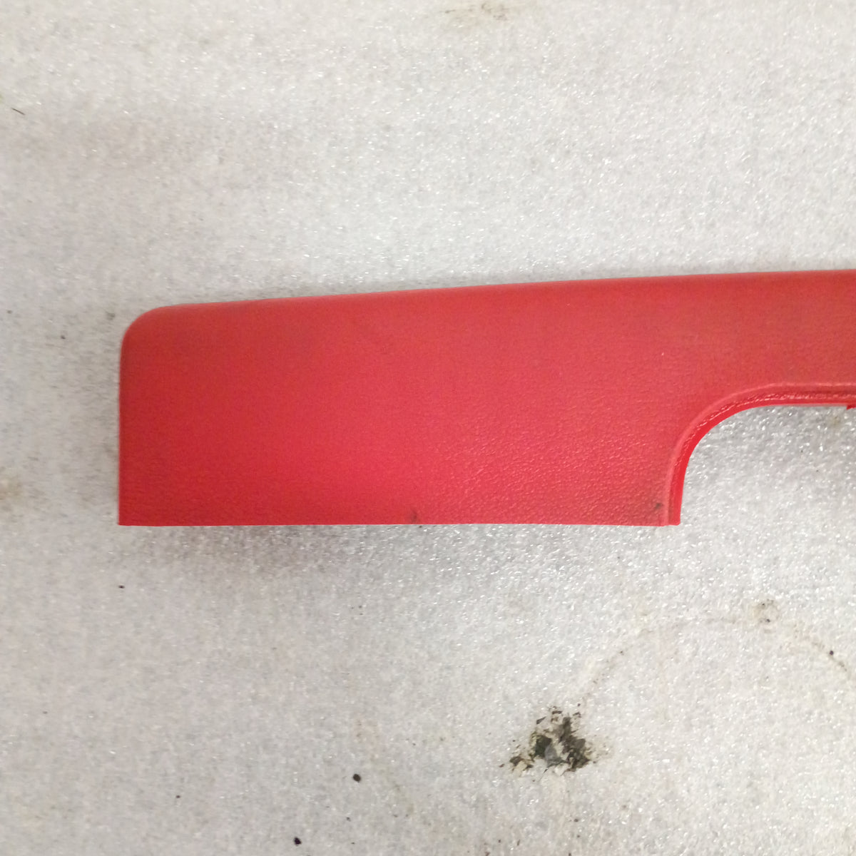 Red armrest from Ford F-series trucks and Bronco, 1973-1979. OEM part with door pull cup.