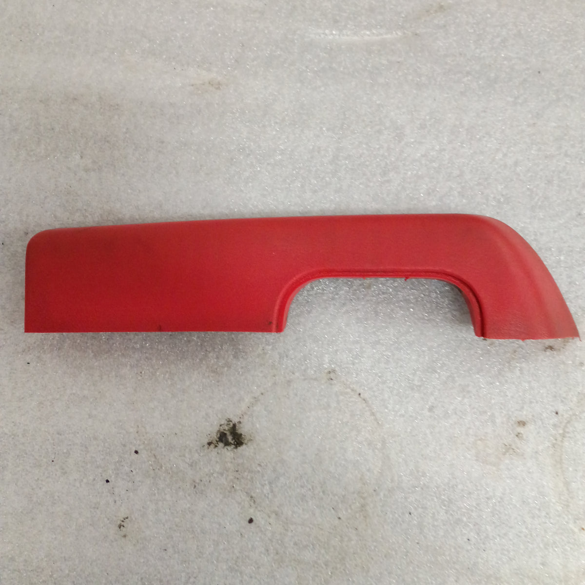 Red armrest for 1973-1979 Ford F-series trucks and Bronco, OEM part, includes plastic cup for door pull.