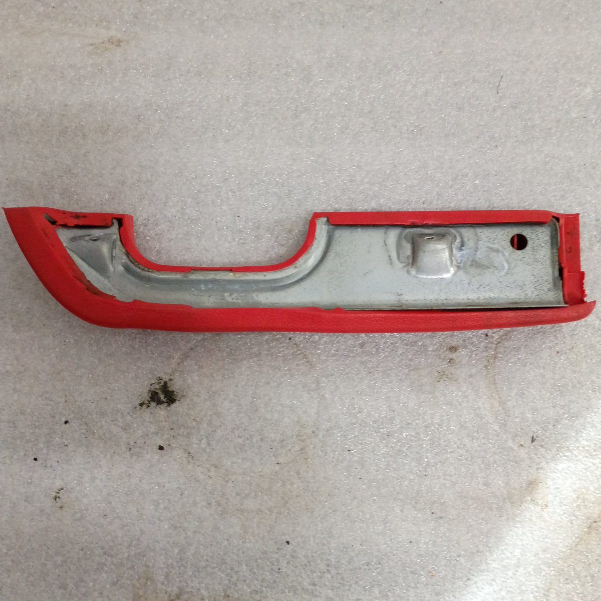 Red arm rest for 1973-1979 Ford F-Series trucks and Bronco, featuring OEM plastic cup for door pull.