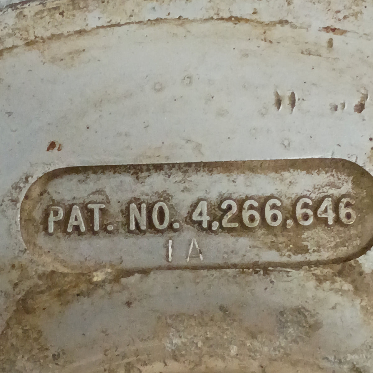 Close-up of a Ford Top Hat Manual Locking Hub showing patent number 4,266,646 on a weathered metal surface.